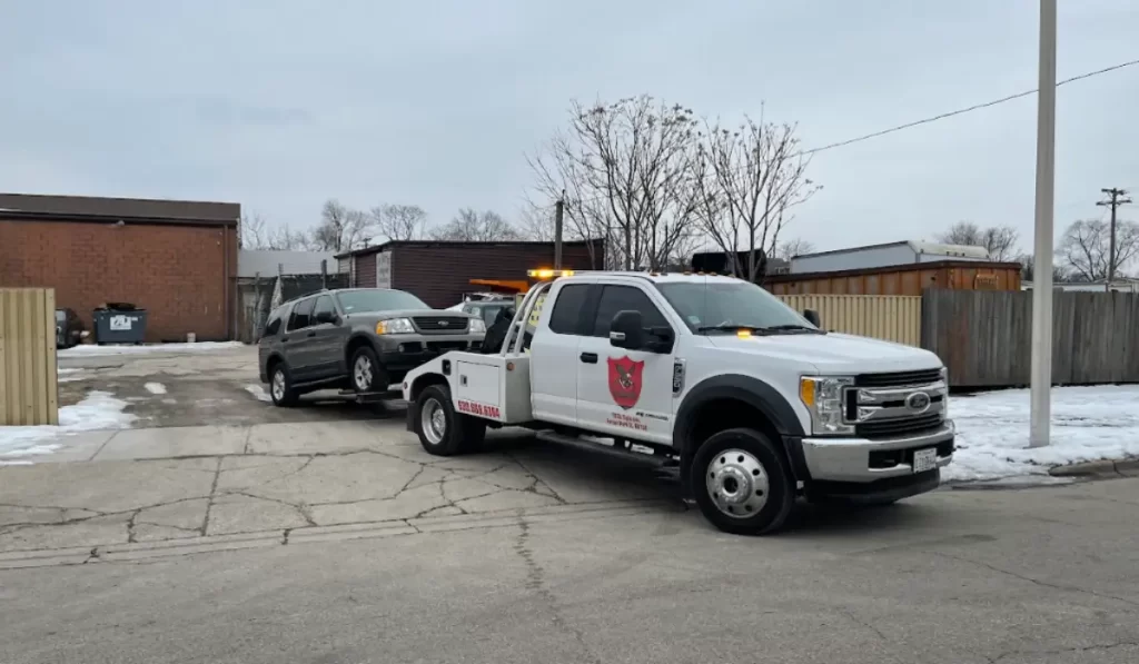 High-mileage SUV being towed, showing mileage matter less during junk car removal and valuation for sellers.